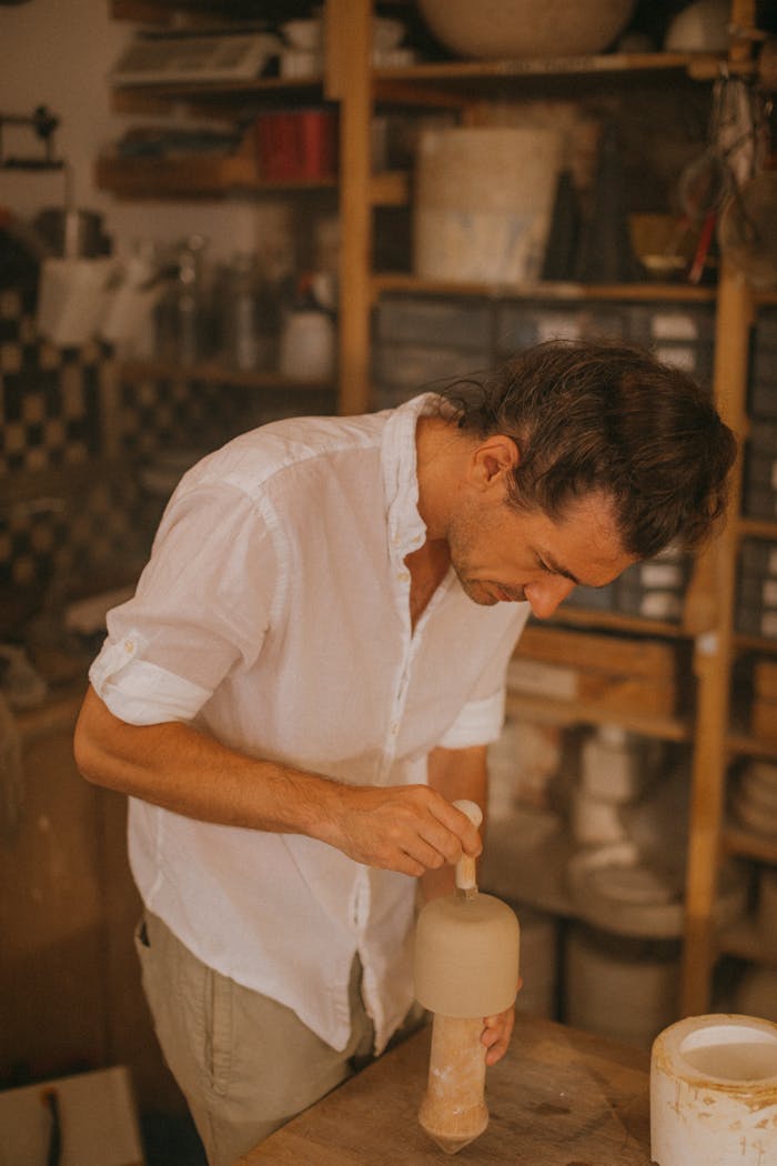 Man in White Button Up Shirt Holding White Ceramic Mug